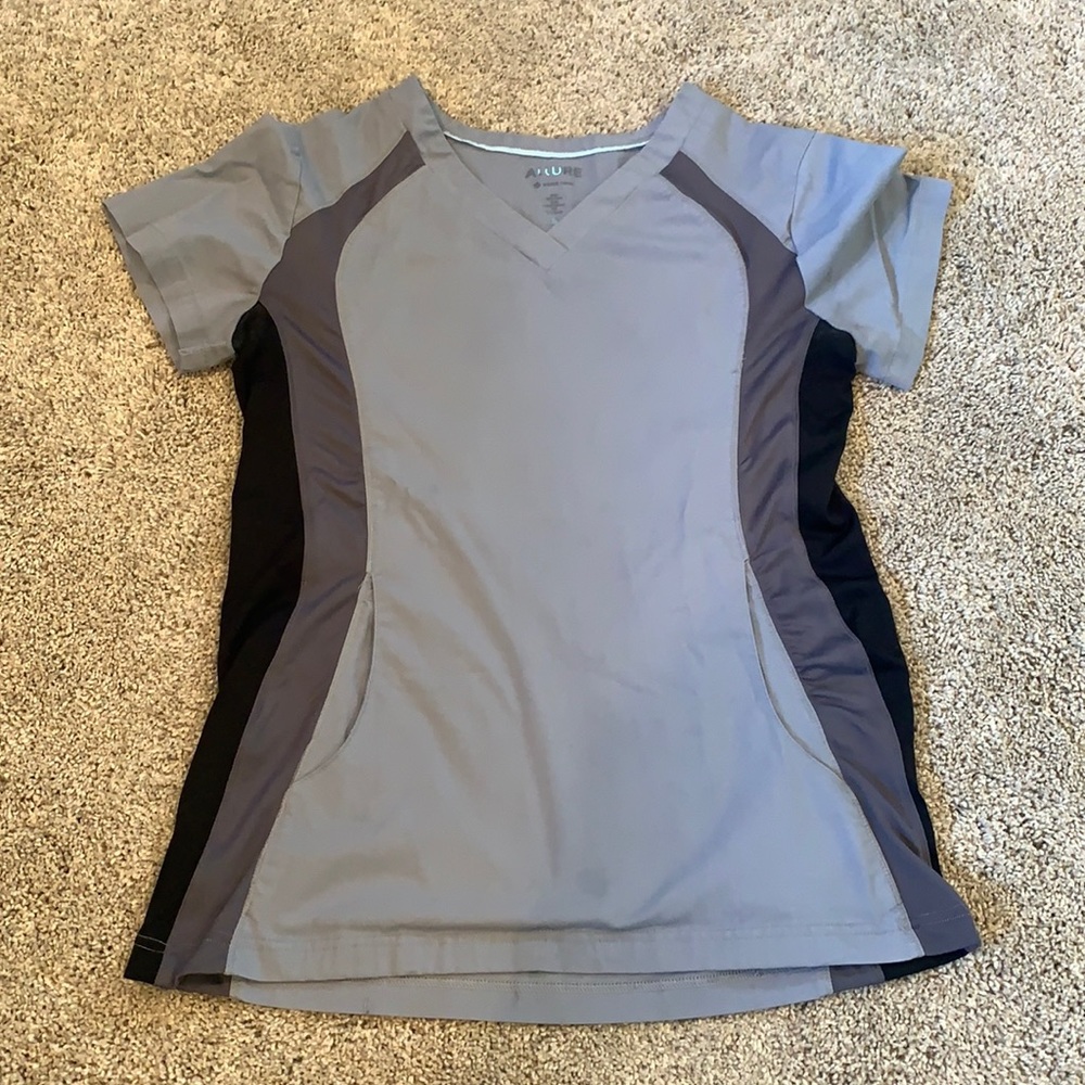 Light blue/gray with black venting scrub top.
